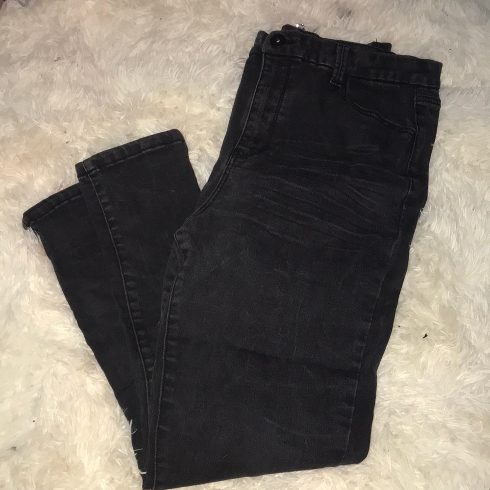 Black super high rise woman’s jeans.